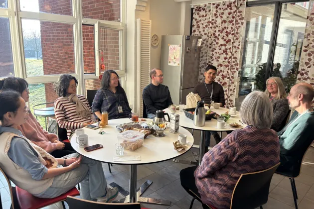 staff having fika in the kitchen. photo.